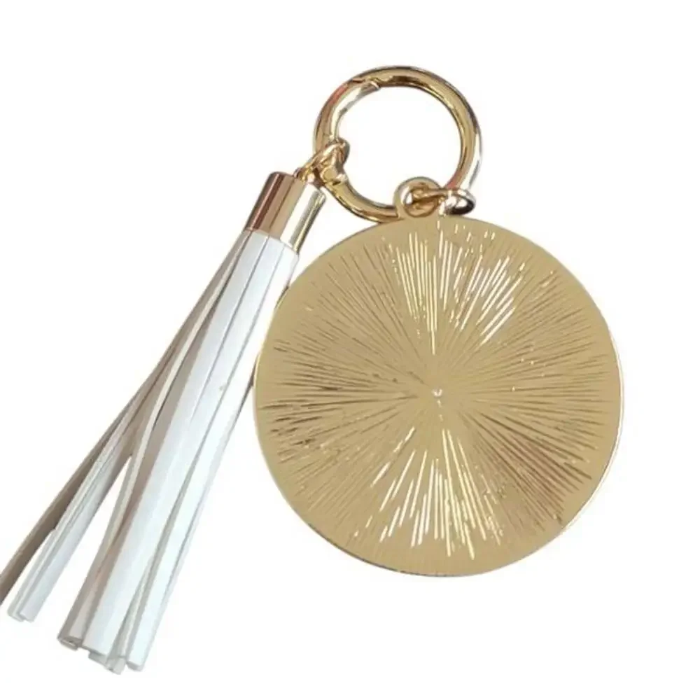Gold and White K Keychain with Tassel